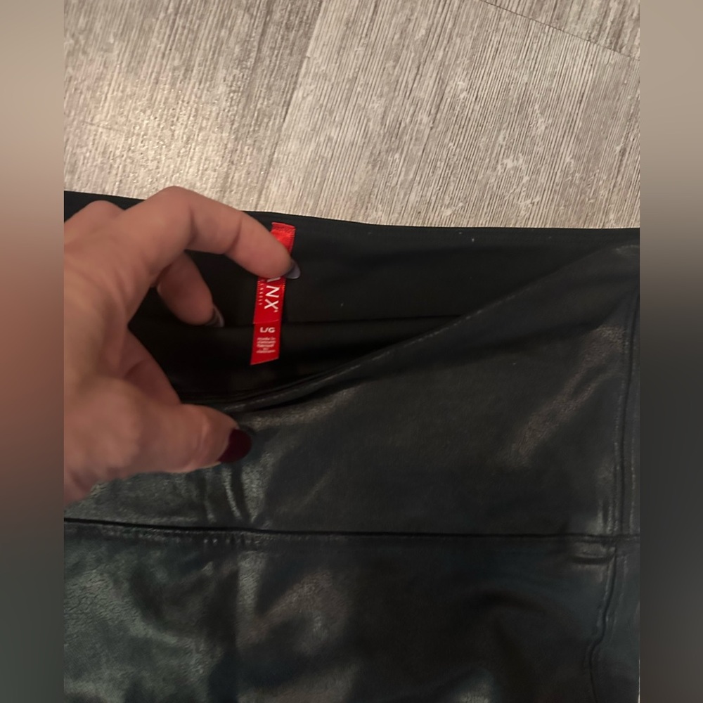 Spanx leather looking leggings. Fits medium size and large